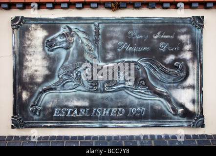 Sign set in wall at fun fair Barry island pleasure park Wales UK Stock Photo