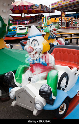Weathered and worn children's roundabout ride unused in funfair Barry Wales UK Stock Photo