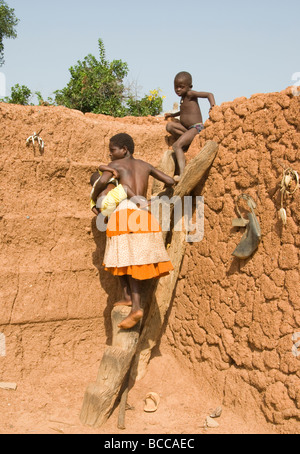 Burkina Faso. Lobi country. Animist family in the Sukala(traditional house). Stock Photo