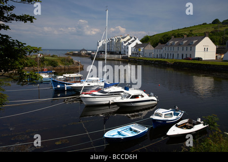 boats tied up at the mouth of the river dun in cushendun county antrim northern ireland uk Stock Photo