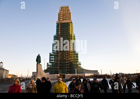 A group of women walking away from Hallgrimskirkja church Downtown Reykjavik Iceland Stock Photo