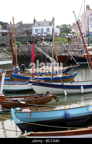 Portsoy Harbour in Aberdeenshire, Scotland, UK, busy with vessels for the annual Scottish Traditional Boat Festival weekend Stock Photo