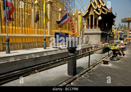 the incense burning altars at Lamphun's Wat Phra That Haripunjaya Buddhist temple Stock Photo