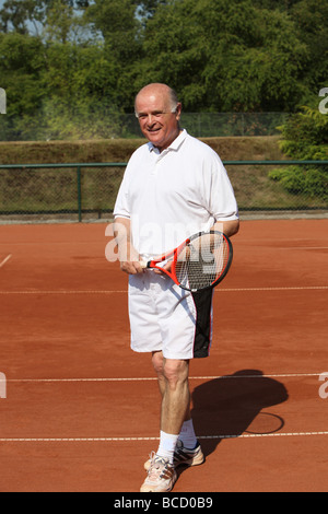 a aktive senior is playing tennis Stock Photo