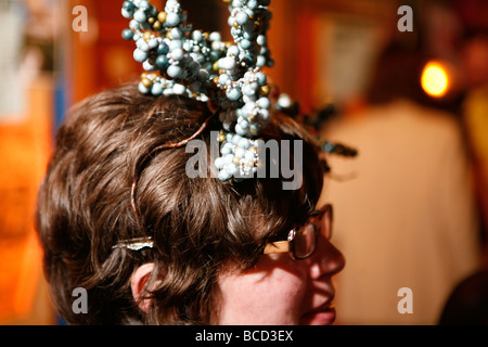 A woman wears a sculpture on her head at the 2009 Rock N Roll Prom at the Blue Bird in Bloomington Indiana Stock Photo