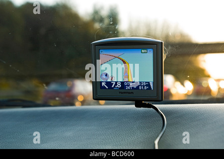 tom tom sat nav attached to windscreen in a traffic jam on M62 Stock Photo