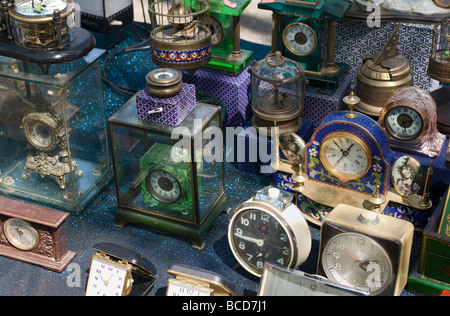 A collection of old clocks on display at an antique outdoor flea market in Kyoto Japan Stock Photo