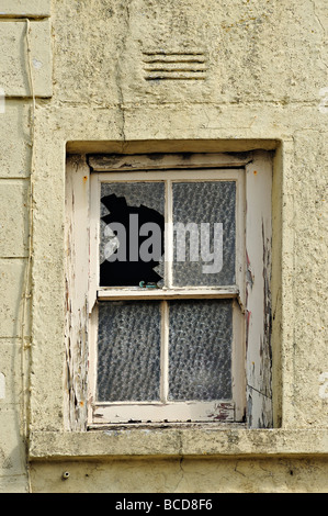 Broken window in old building Stock Photo
