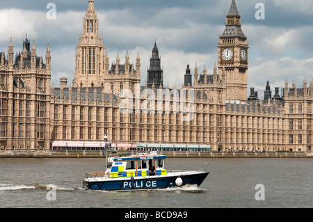 River Police on the Thames in front of the Houses of Parliament Westminster London England UK Stock Photo