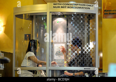 Smoking booth inside Vienna airport cafe, Austria Stock Photo