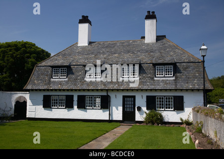 maud cottages whitewashed terraces in the village square cushendun county antrim northern ireland uk Stock Photo