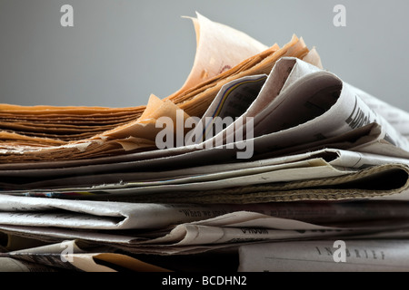 The big stack of old business newspapers Stock Photo