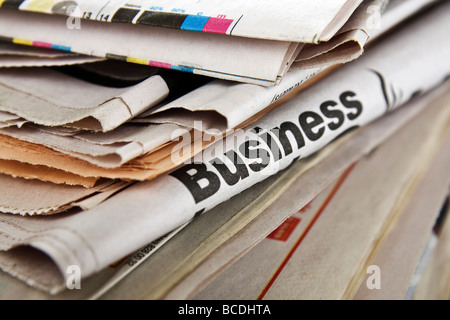 The big stack of old business newspapers Stock Photo