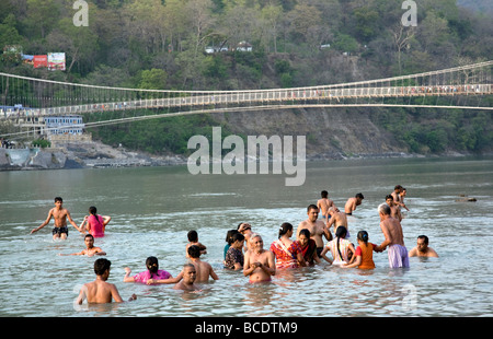 Indian people bathing in the Ganges river. Ram Jhula. Rishikesh. India Stock Photo