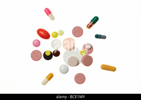 A selection of various colorul pills on white background. Stock Photo