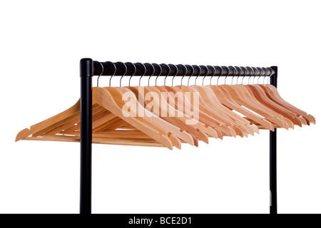Metal clothes rail full of empty wooden coathangers isolated on a white background Stock Photo