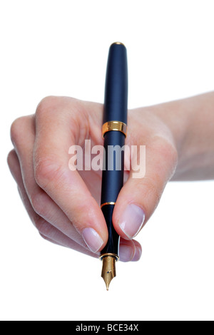 Close up of womans hand writing with a gold nib fountain pen isolated on a white background Stock Photo