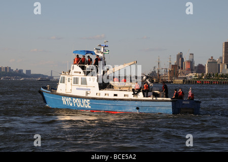 A New York City police boat patrols the Hudson River on July 4, 2009. New Jersey is on the left, midtown Manhattan, on the right Stock Photo