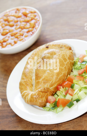 Steak and Stilton Pasty with Baked Beans and Salad Stock Photo