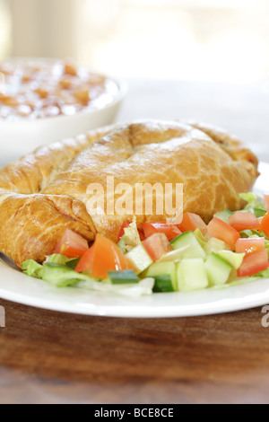 Steak and Stilton Pasty with Baked Beans and Salad Stock Photo