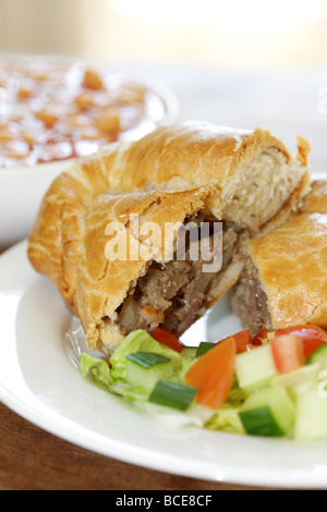 Steak and Stilton Pasty with Baked Beans and Salad Stock Photo