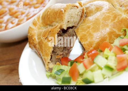 Steak and Stilton Pasty with Baked Beans and Salad Stock Photo