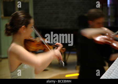 Carolina Kurkowski Perez and Alexander Kiss playing violin Stock Photo