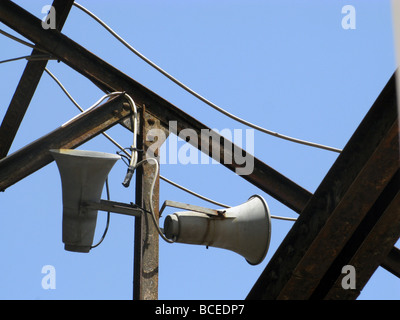 two old megaphones on roof of derelict property Stock Photo