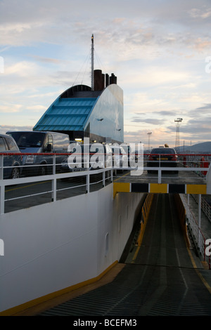 ramp smokestack and cars on the vehicle deck of the norfolkline passenger car ferry mersey viking in port in belfast Stock Photo