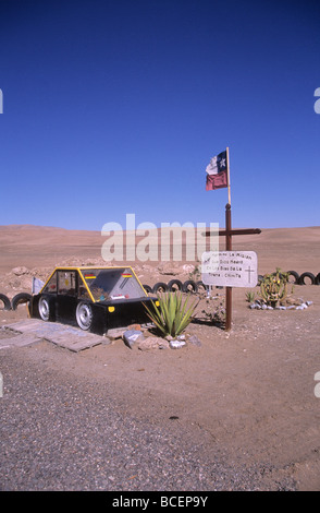 Roadside grave (called an animita de carretera locally) of taxi driver near Iquique , Chile Stock Photo