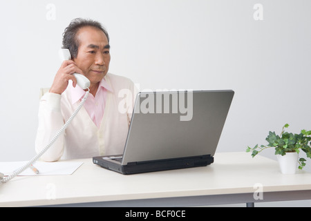 Businessman working in office Stock Photo