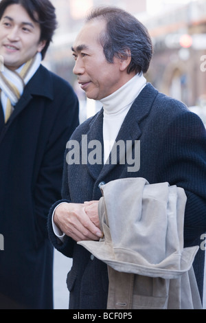 Two businessmen in winter clothes Stock Photo