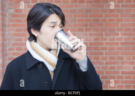 Mid adult man drinking coffee Stock Photo