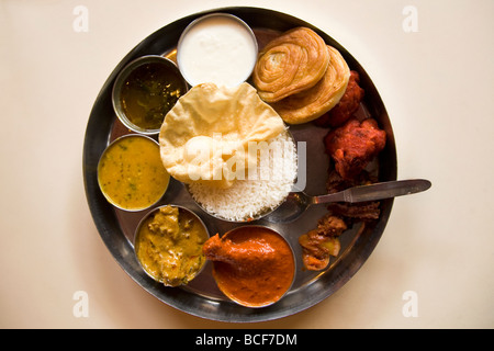 A traditional Indian thali (sometimes known simply as a meal) is served. This is a non-vegetarian thali. Stock Photo