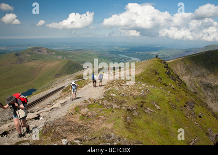 Walkers on the final ridge on their way to the summit of Snowdon Snowdonia North Wales Uk Stock Photo