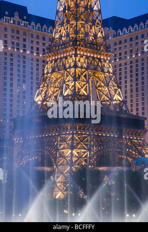 USA, Nevada, Las Vegas, Paris-Las Vegas hotel and Casino along The Strip, evening, through the Bellagio dancing fountains Stock Photo