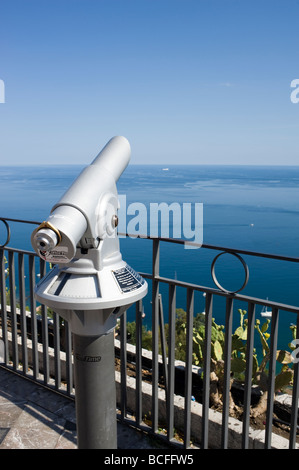 Public telescope looking over coast of Taormina, Sicily Stock Photo