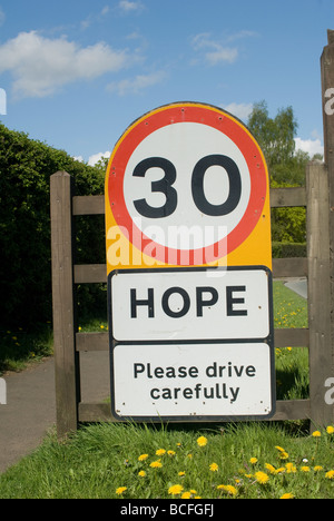 30 miles per hour speed limit sign at the entrance to the village of Hope in the Peak District Derbyshire England Stock Photo