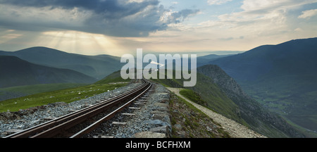 Panorama looking down the mountain railway line on Snowdon towards Clogwyn Station and Llanberis Valley Stock Photo