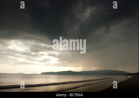 Dark brooding storm clouds over Porth Neigwl Hell's Mouth beach on the Lleyn Peninsula Gwynedd north wales UK Stock Photo