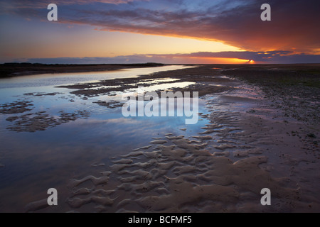 Sunset at Titchwell on the North Norfolk Coast Stock Photo