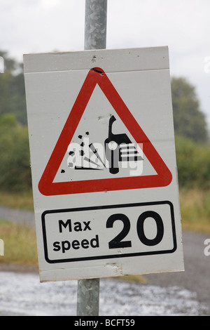 Loose Chippings Max Speed 20MPH Sign On A Country Road Stock Photo