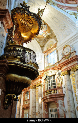 VIENNA, Austria — The pulpit in Karlskirche in Vienna. Karlskirche, or St. Charles's Church, stands tall against the Viennese skyline with its distinct green dome and two flanking columns. The church, an exemplary work of Baroque architecture, was constructed in the early 18th century and is dedicated to Saint Charles Borromeo, a figure known for his dedication to the sick during the time of plague. Stock Photo