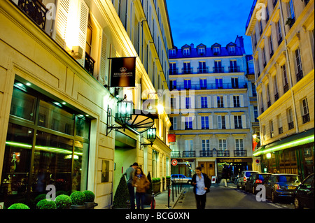 Paris France, Contemporary Luxury Hotel Exterior, 'Renaissance Paris Ven-dome'  Front Exterior, People, on Street at Night, Stock Photo