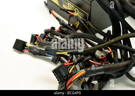 Connecting cables on computer power supply with white background Stock Photo