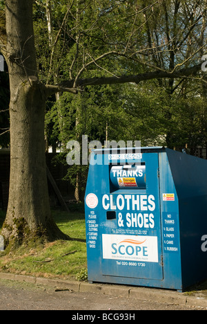 Clothes and shoes charity recycling bin in England Stock Photo