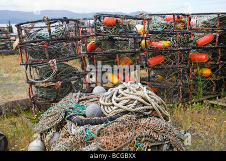 Crab pots or traps fishing nets and buoys decorate a wharf in Garibaldi Oregon on the Oregon Pacific Coast Stock Photo