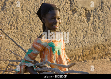 Malian Girl Carrying Firewood in Djenne Mali Stock Photo