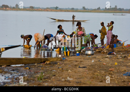 Women and Girls Wasing Dishes in the River in Segou Mali Stock Photo