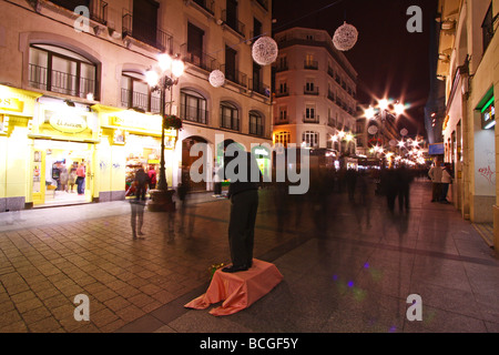 Mime artist performer in the street of Zaragoza at night. Spain, Europe Stock Photo